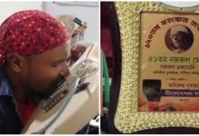 Assam boy plays guitar by tooth